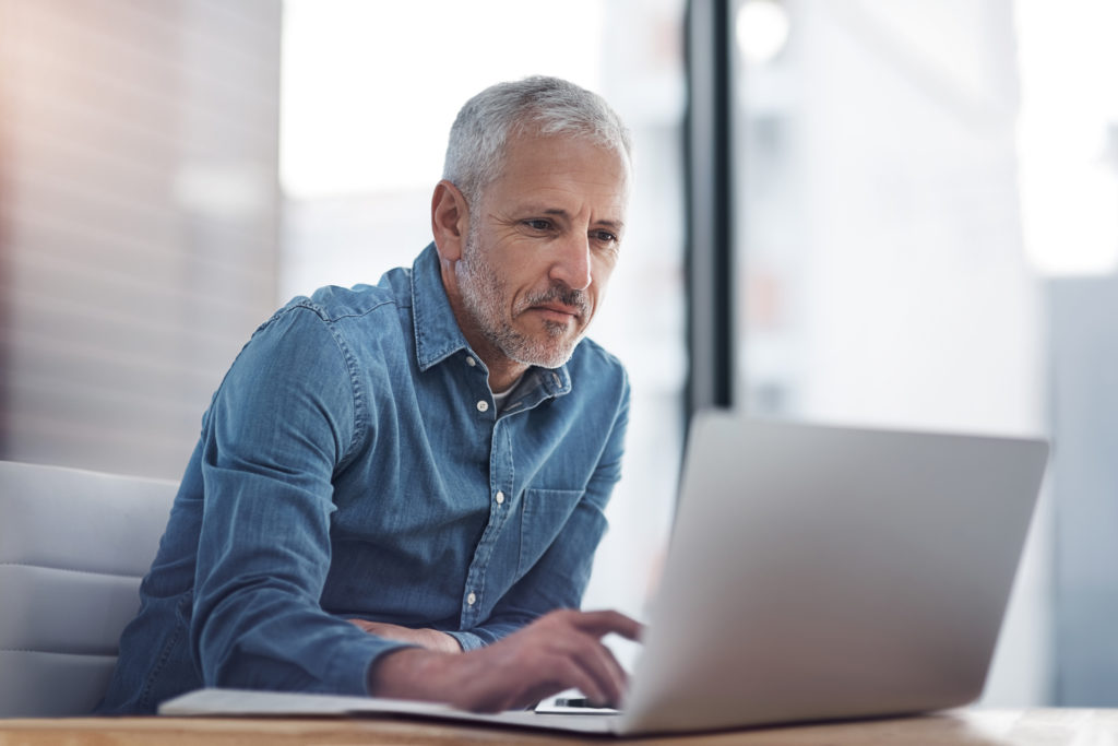 Pastor using Integrated Church Management Software